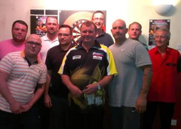 Terry Jenkins (centre) with some of the Perfect 10 league players he took on