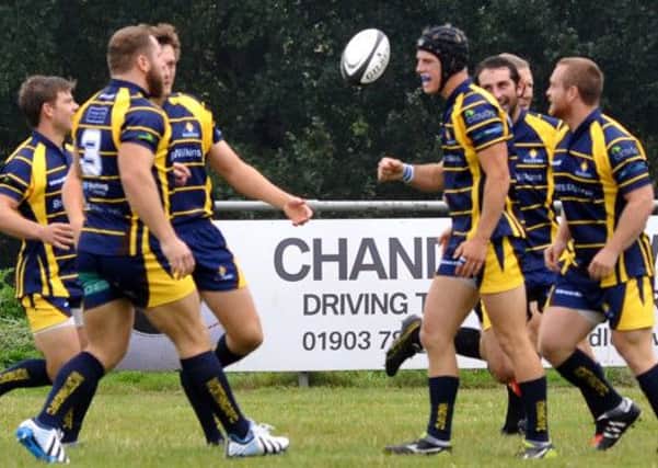 Raiders' players celebrate a try.