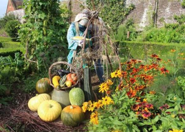 Autumn scarecrows and some of the castles bumper harvest crop on display