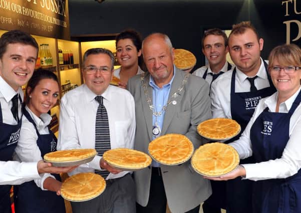 Councillor Graham Tyler celebrates opening of Turners Pies with staffL36601H14