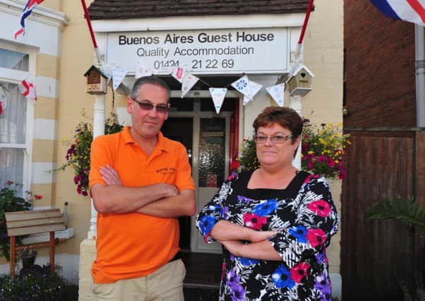 Rachel and Andy Keevil from the Buenos Aires Guest House in Bexhill who are fed up with thieves stealing their hanging baskets