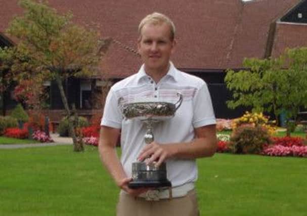 Paul Nessling clutches the Sussex Open Golf Championship trophy