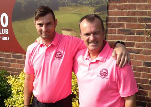 Chris Smith (left) and his father, Don, hit hole-in-ones at Hill Barn Golf Club in the space of two weeks of each other.