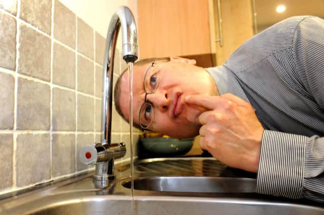 Some residents in Burgess Hill have been complaining about low water pressure. Here Trevor Butler is mystified why there is barely more than a dribble coming out of his kitchen tap. Pic Steve Robards