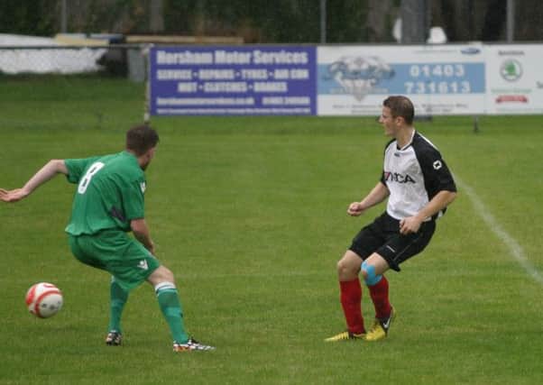 Dave Brown (white/black) scored for Horsham YM. Picture by Clive Turner SUS-140828-072737001