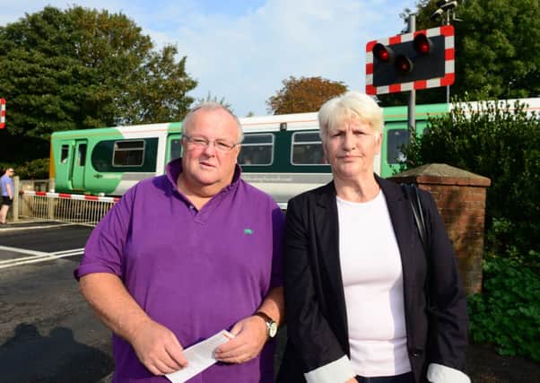 Councillor Mike Northeast and Terri Tanner at the Lyminster level crossing