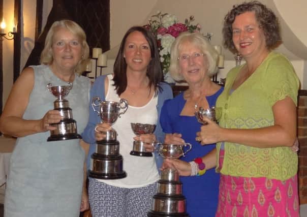 the winners collecting their trophies from the Lady Captain, Rosemary Parvin.  From left: Margaret Jones, Jo Kernohan, Rosemary Parvin (Lady Captain) and Marian Bulley.