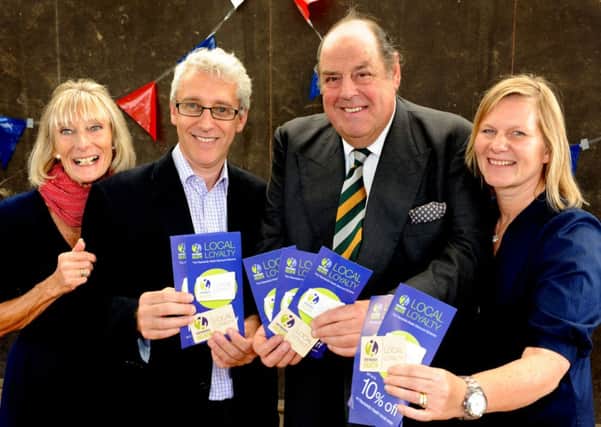 Launch of the new wooden Loyalty Card at Haywards Heath Town Day. Ruth De Meirre, Steve Clarke, Sir Nicholas Soames and Sharon Scott. Pic Steve Robards SUS-140915-172119001