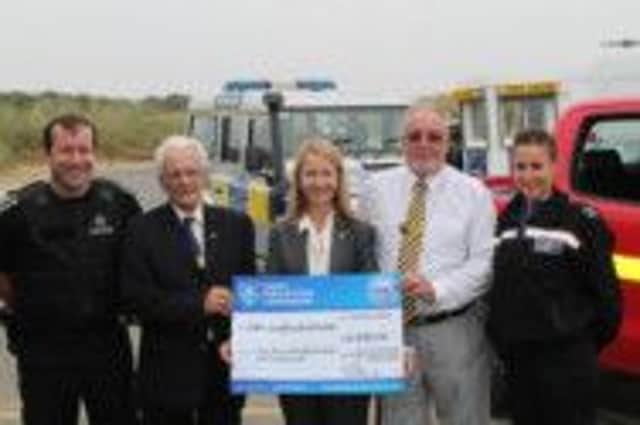 Rother Neighbourhood Watch Chairman Ted Kemp & vice Chair Keith Miller receiving their funding cheque from Sussex Police & Crime Commissioner, Katy Bourne September 2014. SUS-140923-153101001