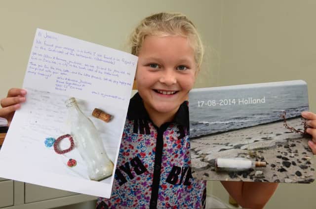 WH 200914 Jessica Page, 8, found a message in a bottle, and had a reply from Holland after sending her own message in a bottle. Photo by Derek Martin SUS-140920-183716001