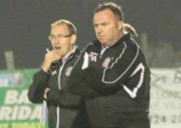 Caretaker manager Nigel Kane (left) and outgoing Hastings United boss Terry White (right) look on during last night's defeat to Tooting & Mitcham United. Picture courtesy Joe Knight