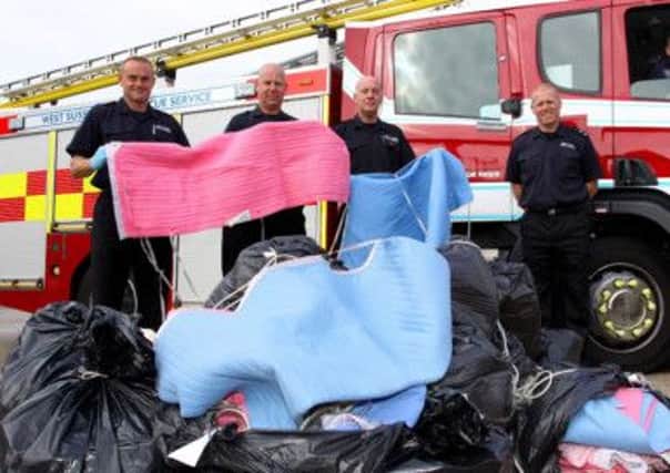 West Sussex firefighters with some faulty electric blankets during an earlier safety campaign in the county. ENGSUS00120121009170733