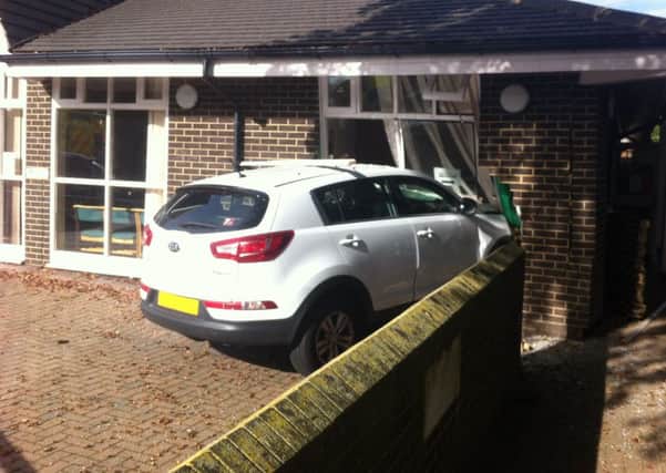 Vehicle collides with church hall in Broadbridge Heath SUS-140925-105232001