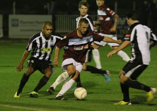 Sam Adams on the ball for Hastings United during their 3-0 defeat at home to Tooting & Mitcham United on Monday night. Picture courtesy Joe Knight