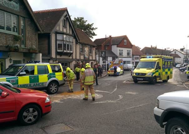 A car and a motorcycle were involved in a collision in Storrington High Street this afternoon (submitted). SUS-140929-174017001