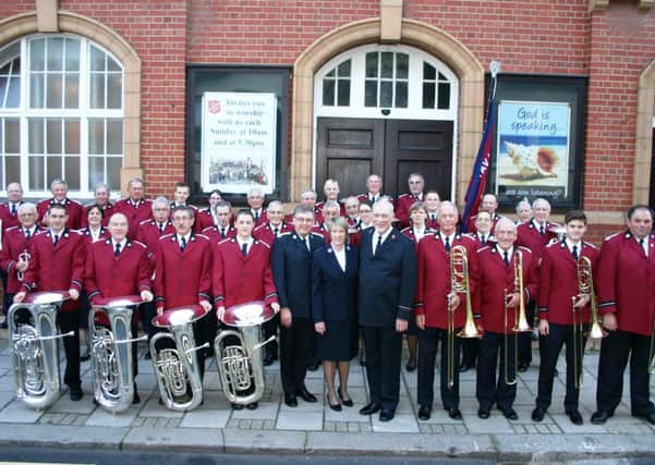 Guest bandmaster William Himes and Linda Himes with the members of the Worthing Salvation Army Band