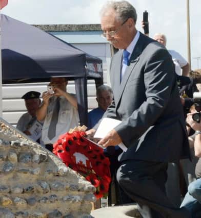Chris Vowles laying a wreath at the memorial