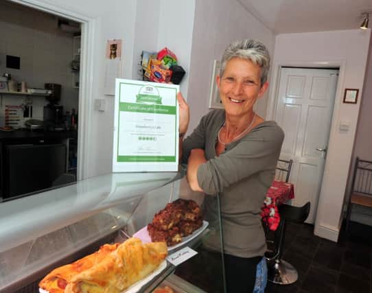 12/6/14- Audrey Lapworth at Strawberries Cafe in Bexhill- winner of the Certificate of Excellence from Tripadvisor. SUS-141206-131512001