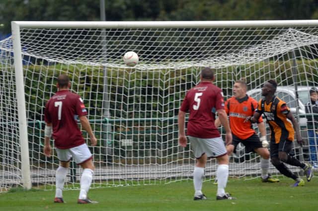 The Hastings United goal comes under attack during last weekend's defeat at Three Bridges. Picture by Jon Rigby (SUS-140710-121850002)