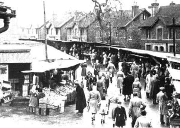 Market in Piries Place in Horsham in the 1950s (photo courtesy of Horsham Museum). SUS-140910-161256001