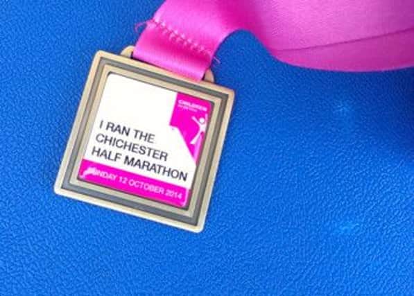 A Chi Half 2014 finisher's medal