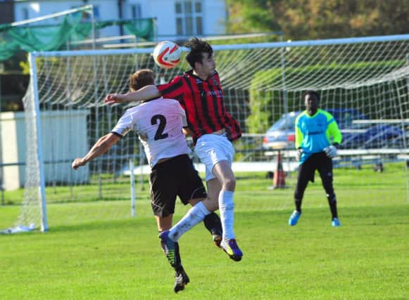 Action from Bexhill United's 1-1 draw at home to Oakwood on Saturday. Picture by Steve Hunnisett (SUS-141110-180826002)
