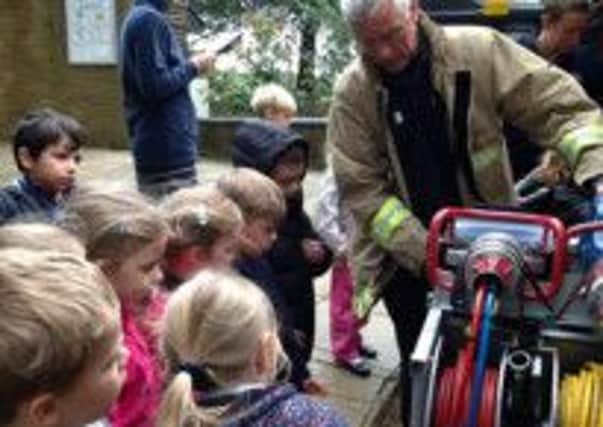 Firefighters from Battle Fire Station visit Vinehall Pre-Prep School. SUS-141016-093144001