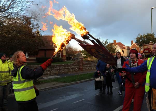 Organisers are urging spectators not to pick up the lit torches