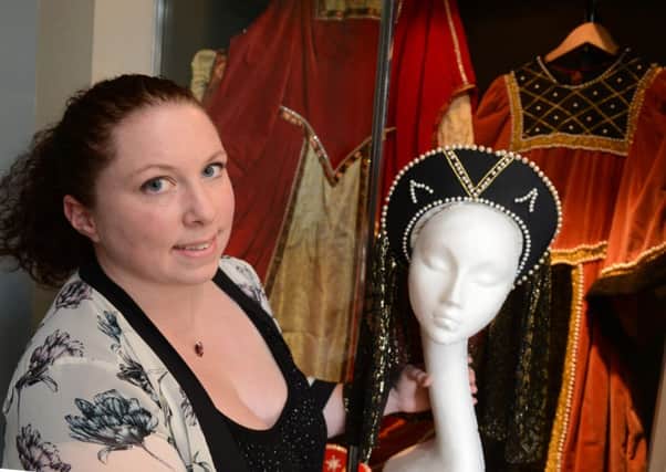 Museum curator Juliet Thomas with Littlehampton Bonfire Night costumes on display D14421083a