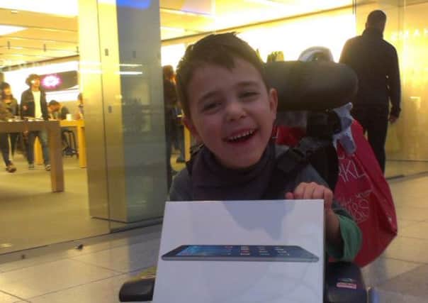 Harry Crayford with his new iPad, bought with donations from the public