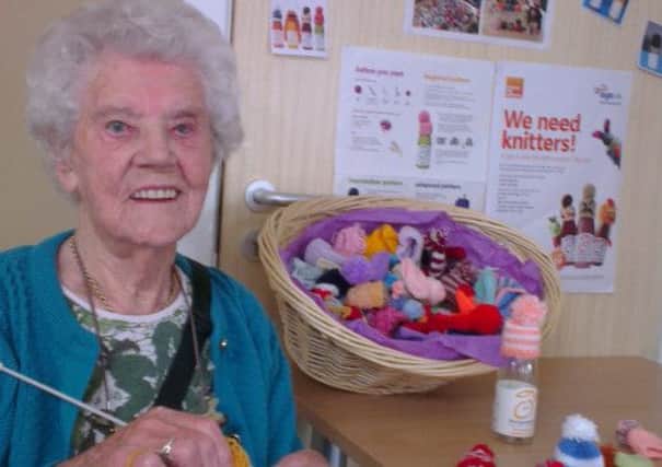 Join Win Kurn (pictured) in taking part in Age UK's Big Knit SUS-141021-100729001