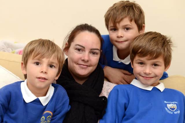 WH 211014 Emma O'Regan has launched a search for a new kidney after her friends and family were not matches. Also highlighting the need for organ donors. Pictured with her boys L to R Louie 5 and twins Ryan and Alfie 8. Photo by Derek Martin SUS-141022-104903001