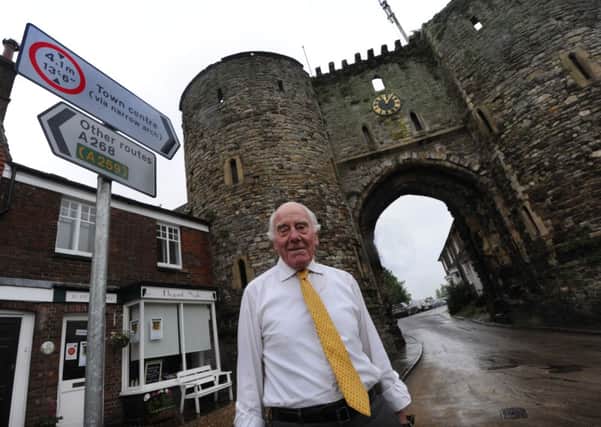 John Bragge showing the new road sign at Landgate Arch, Rye. 6/6/11 ENGSNL00120110606112214
