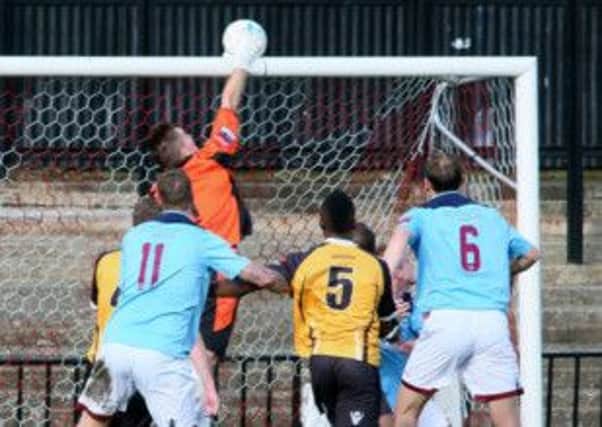 Hastings United goalkeeper Josh Pelling tips the ball over the crossbar during the 2-0 FA Trophy defeat away to Cray Wanderers on Sunday. Picture courtesy Joe Knight