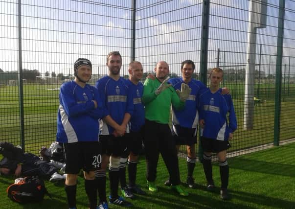 Worthing Churches Homeless Project's team at Brighton & Hove Albion's  training ground in Lancing