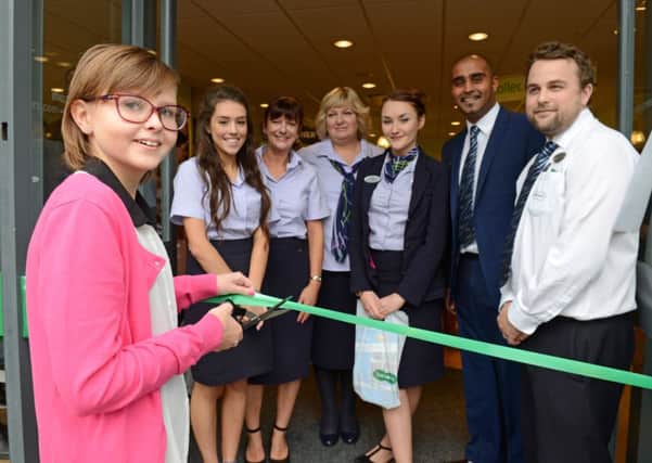 LG 261014 Specsavers in Rustington is opened by Freya Angilley, 13. Photo by Derek Martin SUS-141026-213305001
