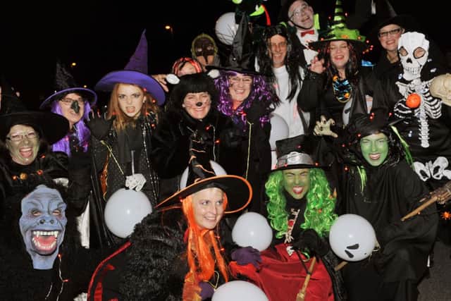 Members of the Edwin James Festival Choir looking spooky in their parade costumes L43742HJ14
