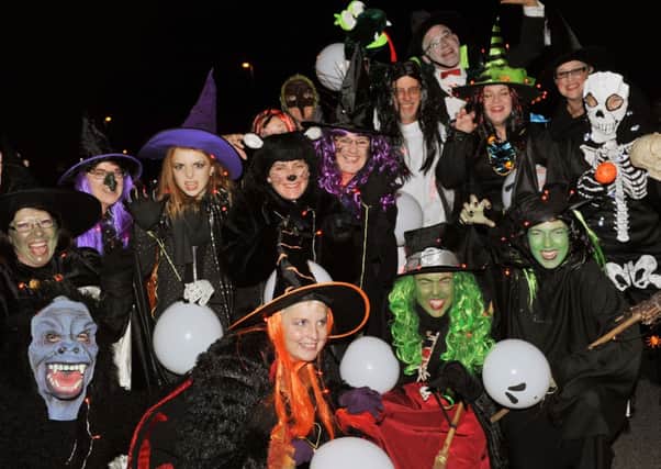 Members of the Edwin James Festival Choir looking spooky in their parade costumes L43742HJ14