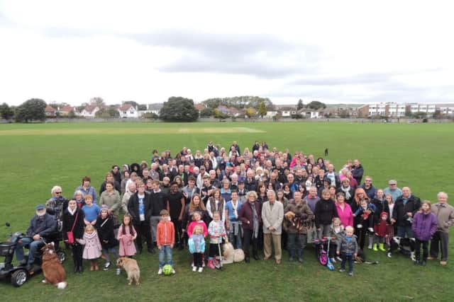 Residents gather at the Manor Sports Ground on Sunday to show their support to the action group. SUS-141027-124030001