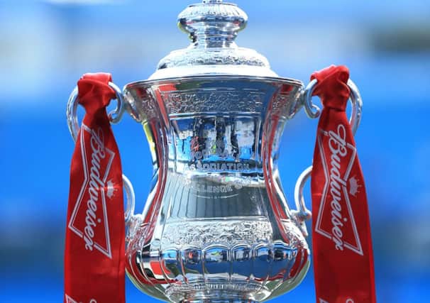 The FA Cup trophy on display at the Etihad Stadium prior to kick-off PPP-140424-121636002