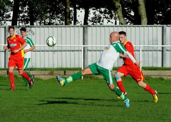 Daren Pearce stretches for the ball in Chichester's defeat to Newhaven   Picture by Kate Shemilt C140972