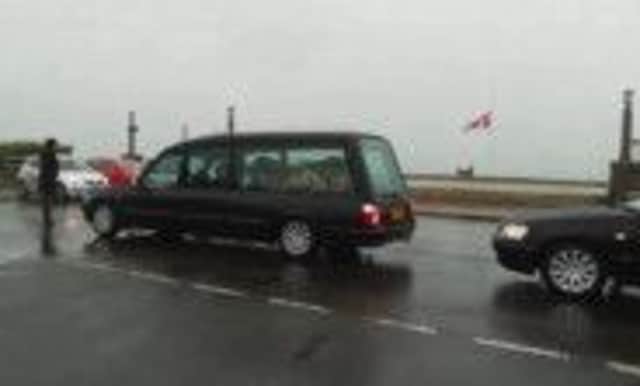 The funeral procession of Chris Vowles makes its way past the Canadian memorial SUS-141028-091933001