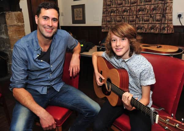 24/10/14- Keane's Tim Rice-Oxley gives advice and guidance to Will Pollard- part of Battle Festival.  Will Pollard is the grandson of popular local man Derek Norcross. SUS-141024-131209001