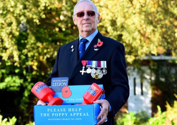 Poppy concern. Derek Moore (Royal British Legion Memeber), who is offering a helping hand to the Royal British Legion in Littlehampton after they announced they were in trouble with this years poppy appeal. Littlehampton. Picture : Liz Pearce. LP281014PO02 SUS-141028-165952008