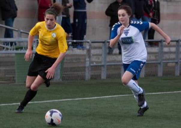 Emma Alexandre (in yellow) helped Chichster to a cup win at Burgess Hill
