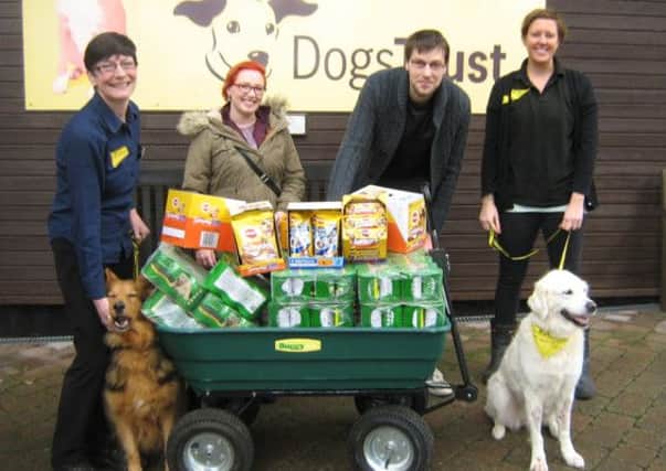 Tracey Rae, left, and Naomi Tucker from Dogs Trust accept the Sainsburys donation