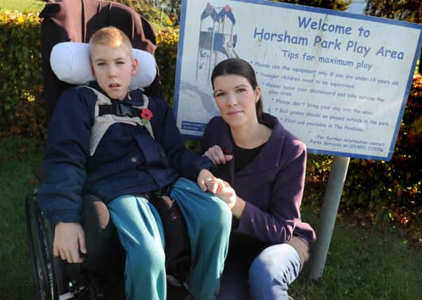 JPCT 061114 S14470038x Kerry McGivern is one of the parents who want facilities for wheelchair bound children at Horsham Park, pictured with her son Dylan, 11 -photo by Steve Cobb SUS-140611-103305001