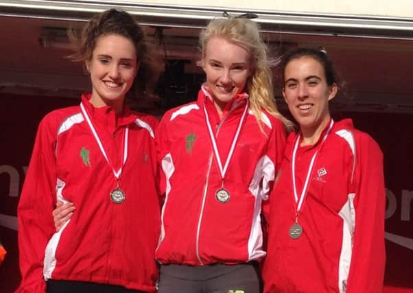 Grace Baker, left, part of the Aldershot, Farnham & District team which won under-20 women's gold at the National Cross-Country Relays in Mansfield