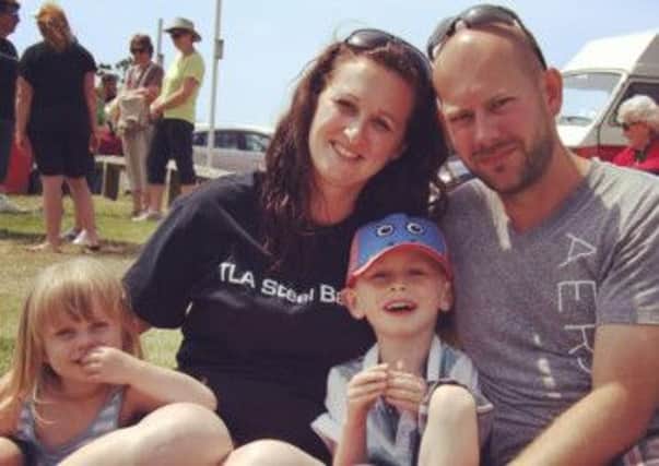 Amy Simmons, who was helped by the blood transfusion service SERV Sussex with her family George, five, Madeleine, three, and her husband Paul - picture submitted