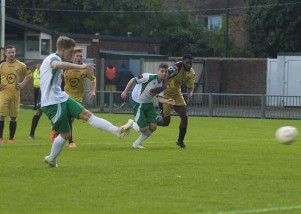 Ben Johnson slots home his second penalty against Wingate    Picture by Tommy McMillan